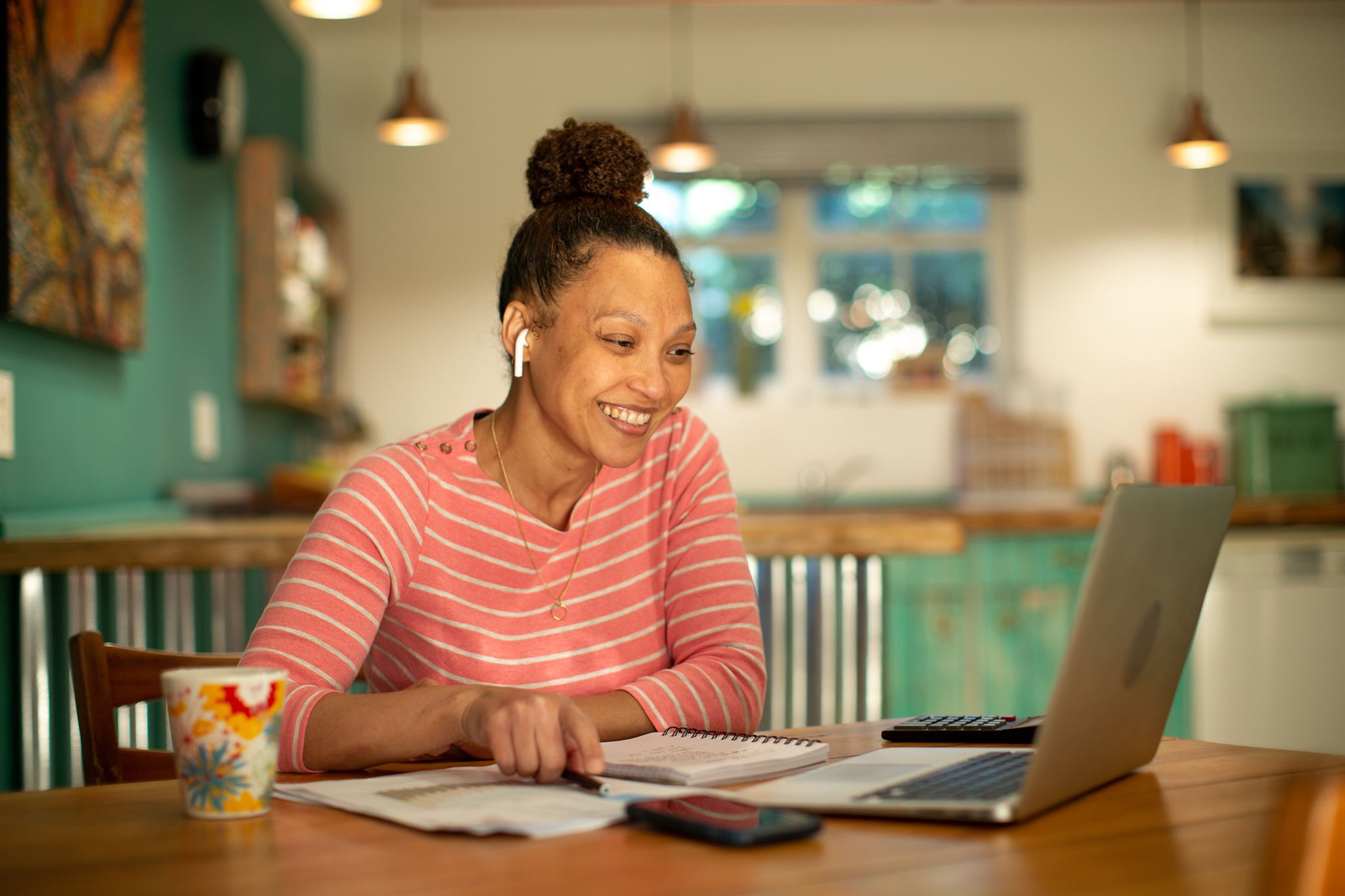 Smiling-woman-using-laptop